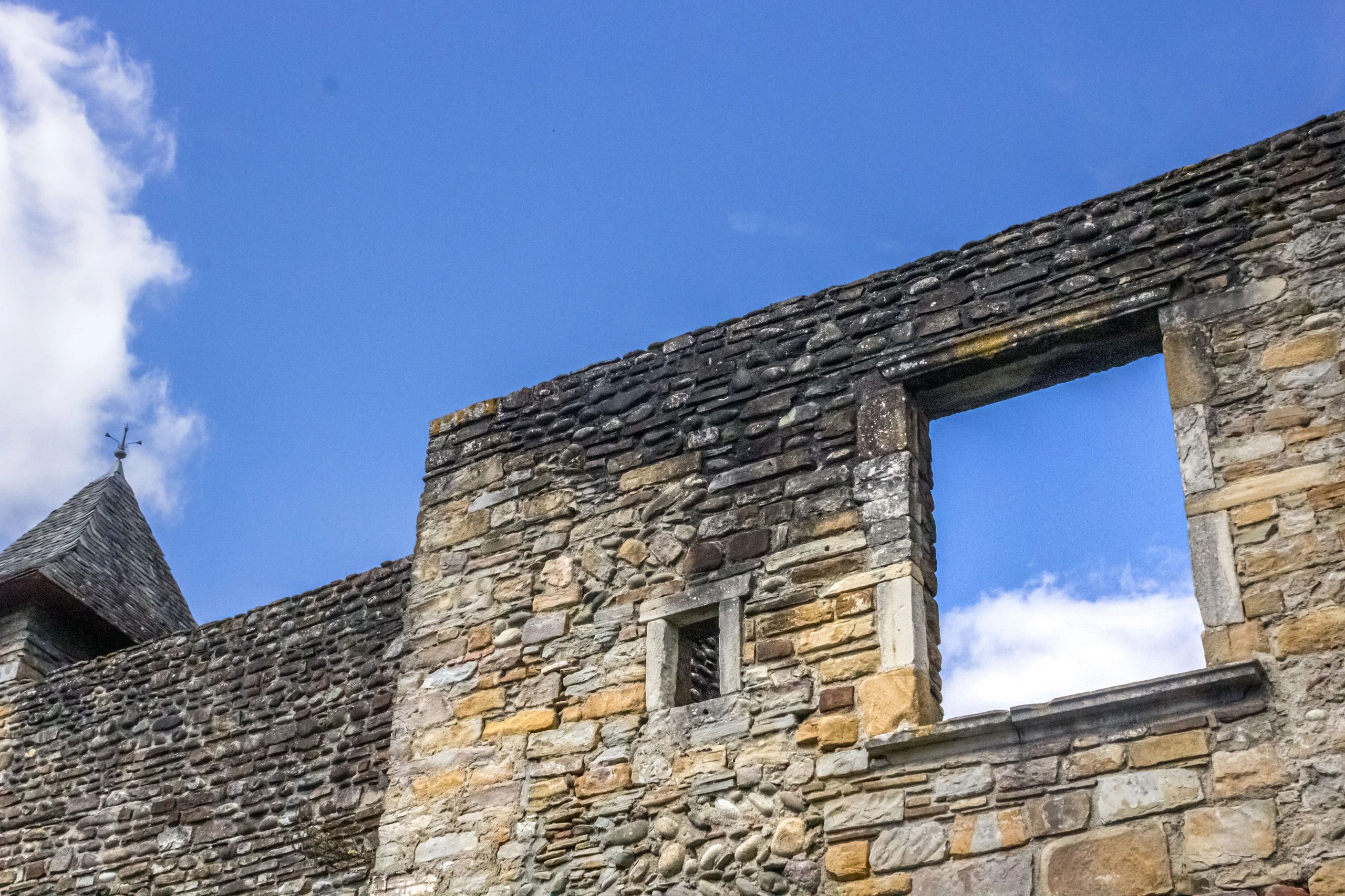 Stone wall with window opening to the sky