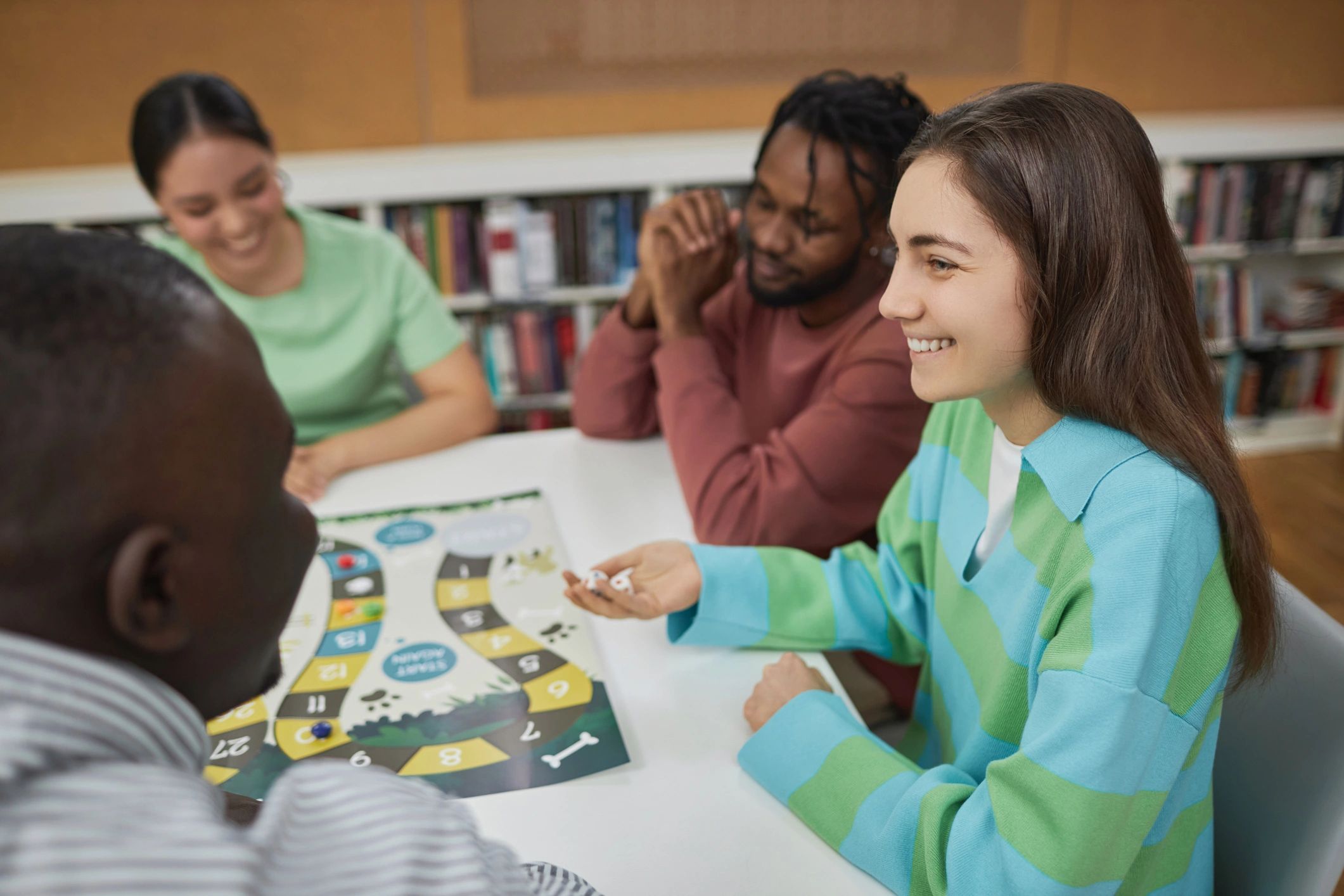 Group playing a board game at a table