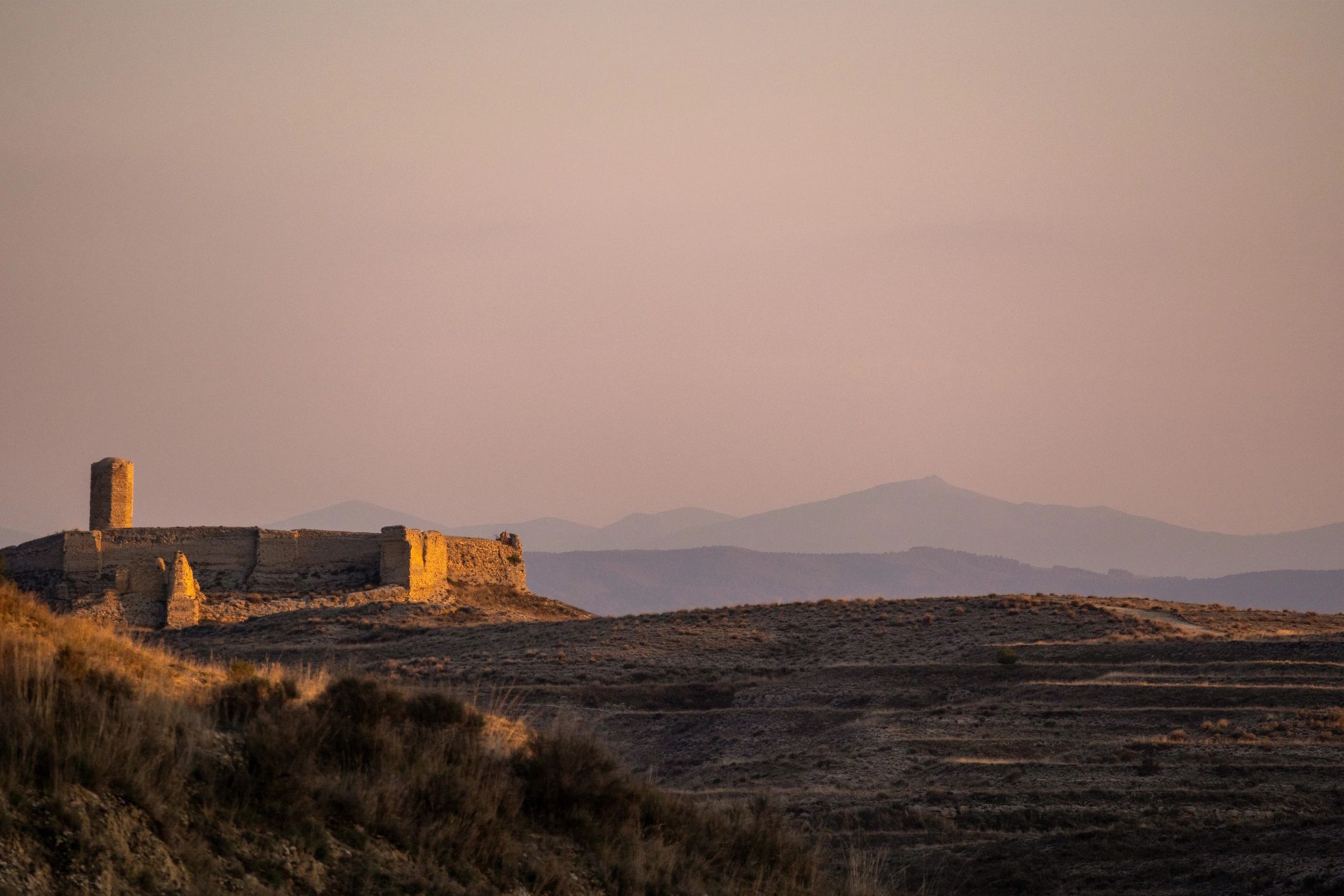 Stone castle exterior at sunset